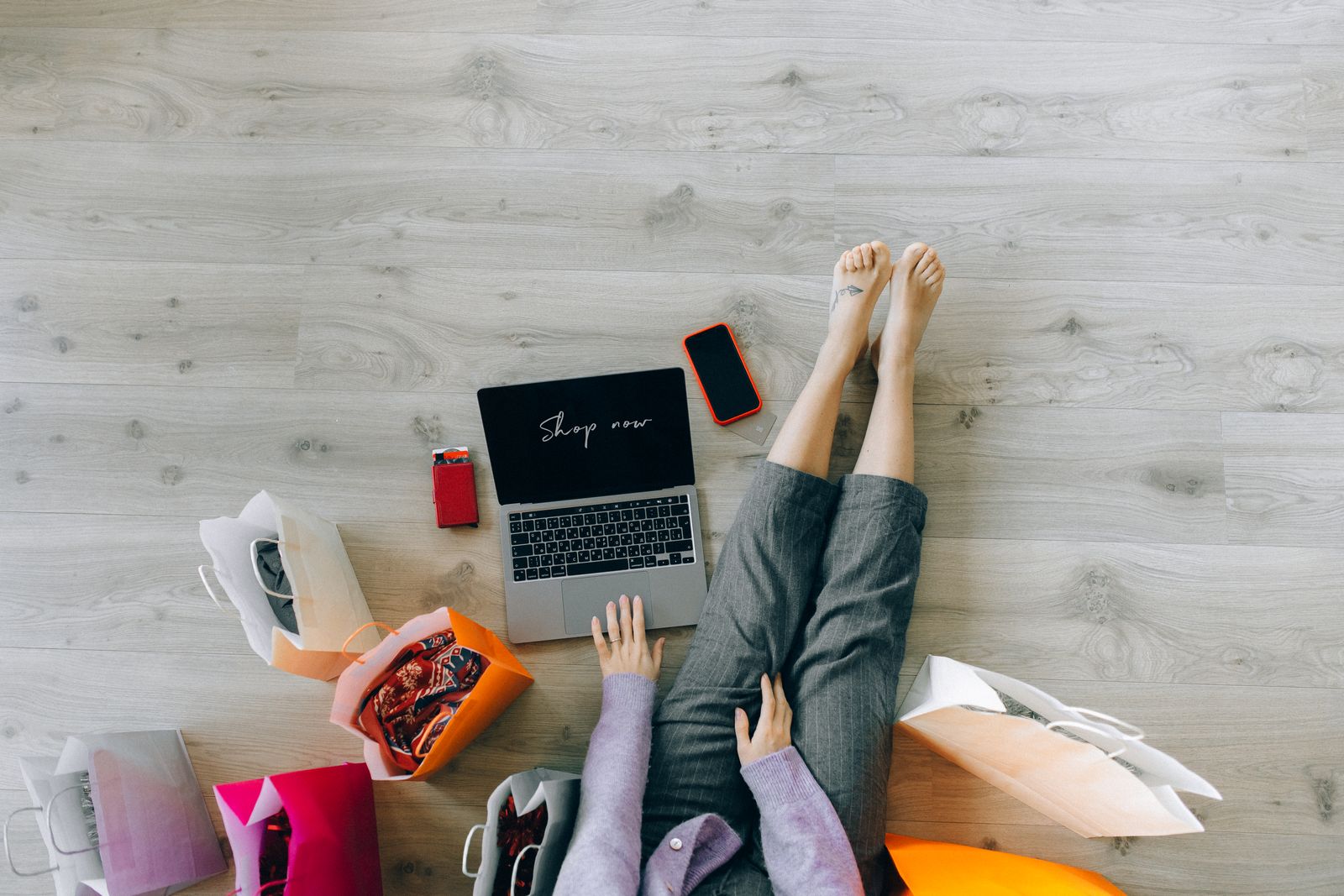 pexels-about-shopnow Top-down view of a laptop showing Shop Now with shopping bags